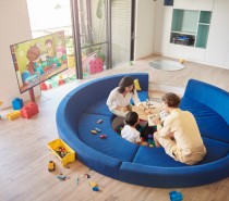 In other homes, the television would serve as the primary source of entertainment… but any young kid would surely find the ball pit to be the main attraction in this fun-filled design.