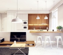 Wood elements are balanced well to lend a sense of visual weight and depth to the otherwise small apartment. The recessed kitchen counter is especially neat and cozy-looking, outfitted with vertical wood grain from top to bottom.