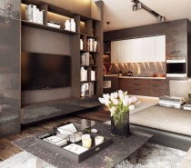 The first apartment creates a classic look with only the most modern materials and furnishings, a difficult feat to accomplish but executed perfectly here. An interesting layout allows the living spaces to feel cozy and intimate despite the scale of the space, and made even cozier by the addition of warm wood tones to the mostly gray and white color theme.