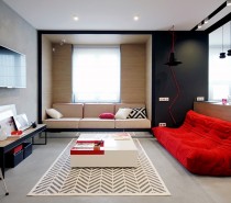 First, let's look at a home that packs tremendous character into a modest yet versatile 56 square meters. Nika Vorotyntseva designed this apartment for a young woman who lives in the city. Energetic red accents ensure the home's unique personality speaks out through every detail. The color theme is mostly uniform all the way across, with just a few dashes of secondary accents employed in surprising places. Red is a rare interior theme because it's difficult to work with, but this apartment makes it look like a breeze.