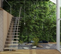 A lush vertical garden reaches to the heights of the atrium and is easy to appreciate from the mezzanine level above. Note the small wood platform in the middle of the rock garden – certainly a wonderful place to read or meditate.