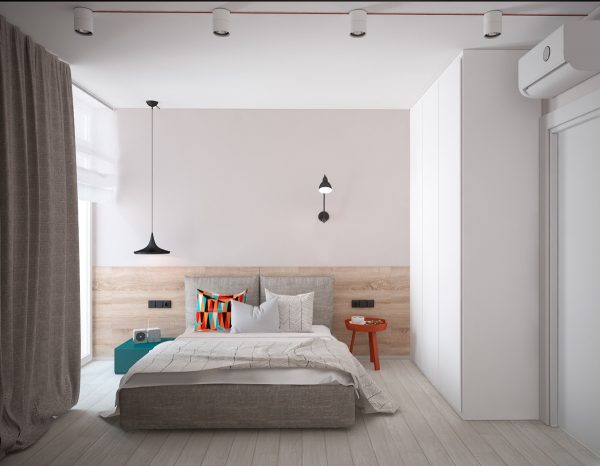 A minimalist bedroom offers a respite from the art deco theme, while subtly referring back to it. Muted teak floors with burnt orange and teak fixtures mark either side of the master bed, while boxed shelves in the same colour offer storage and a point of difference.