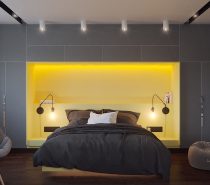 Check out this super bright design! The forms seem to retain a strong minimalist element, but the bright yellow headboard area pops out from the greyscale surroundings and definitely pushes this space more toward the side of futurism. High-end furniture and lighting makes a strong statement with their sculptural forms.