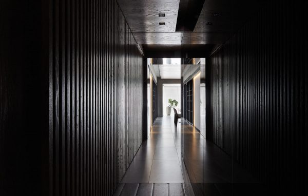 Black Acrylic, Glass and Stone Form This Dark and Sophisticated Apartment Interior