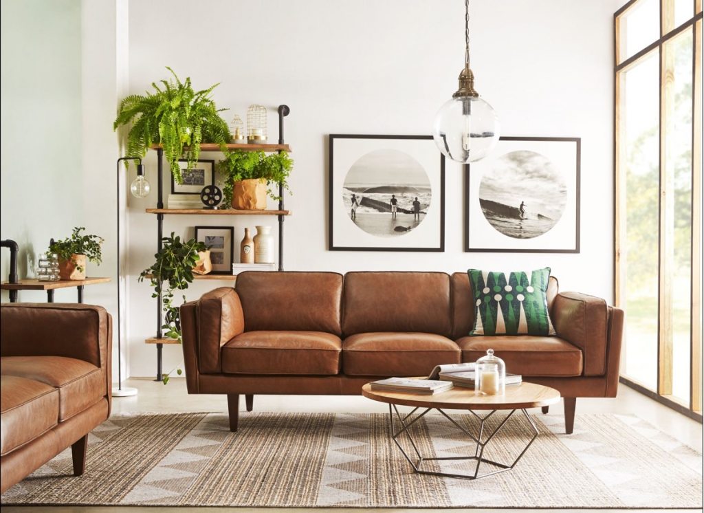 brown leather sofa black and white photos mid century modern living