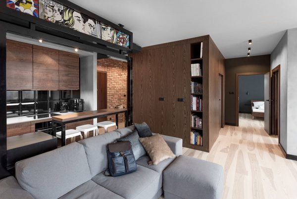 Three Homes Using Exposed Brick, Wood Panelling and Grey To Their Advantage