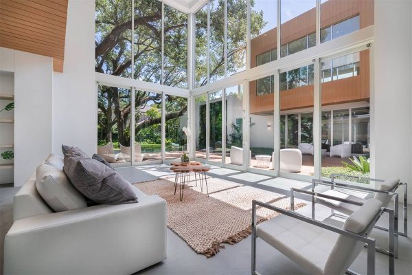 Shiny New Miami Mansion Under A Canopy Of Oak Trees