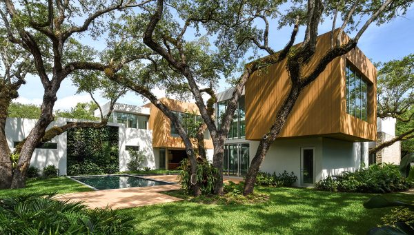 Shiny New Miami Mansion Under A Canopy Of Oak Trees