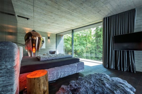 A Sculptural Concrete-Clad Modern Villa In Germany
