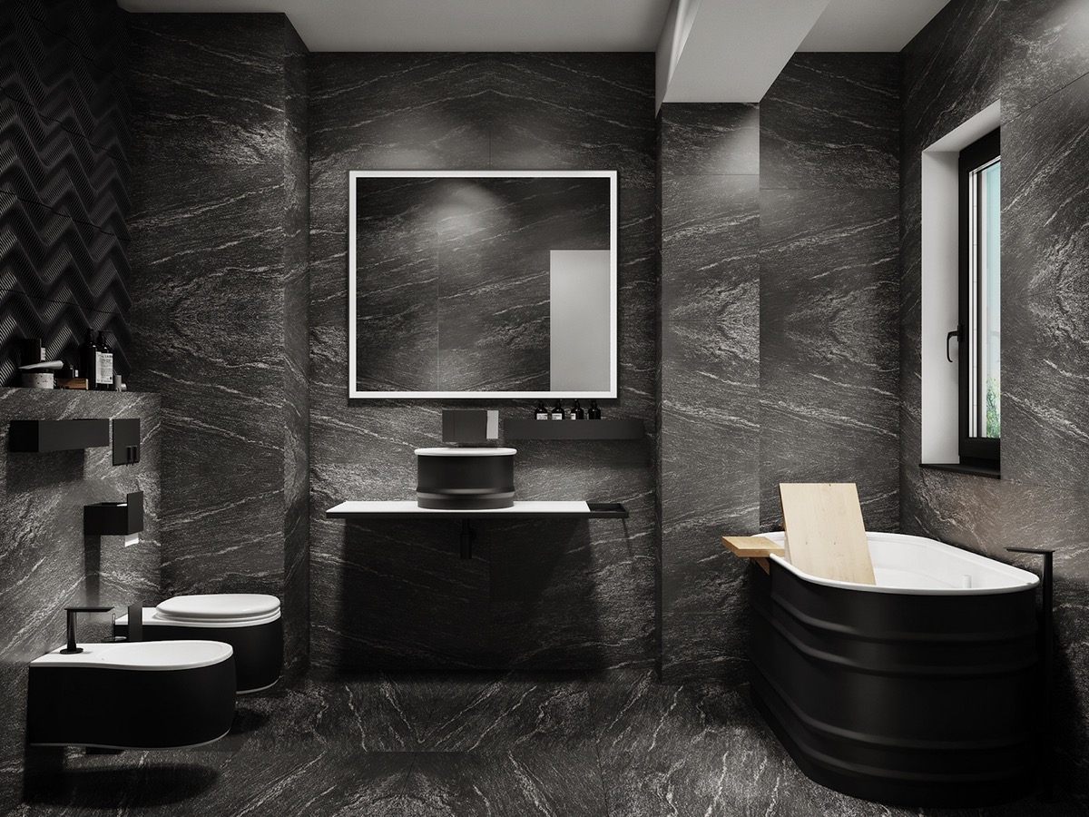 Black, grey and white marble tiles on the walls and floors blend together accented with black bath and toilets.