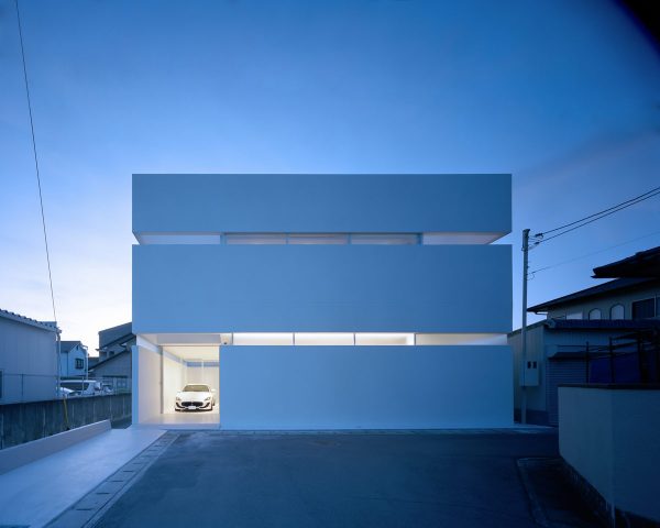 A Modern Minimalist House That Showcases A Maserati
