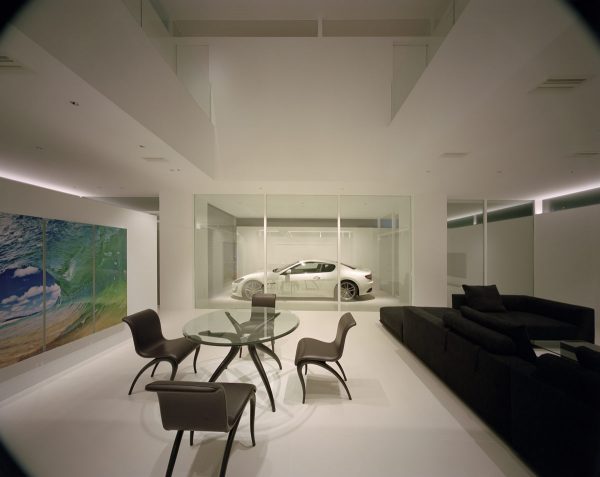 A Modern Minimalist House That Showcases A Maserati
