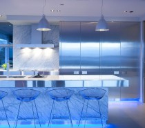 The designer chose blue LED lighting to infuse this modern kitchen with almost underwater-like ambiance.