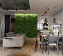 In this first home, one wall in the kitchen, stretching from the floor to the ceiling, is covered in plants. In an otherwise neutral toned open home that utilizes gray, white, brown, and black, the pop of vibrant green is instantly eye catching. In order to the keep the plants alive and thriving indoors, creative measures must be taken. Here, a skylight above the wall allows for natural sunlight to stream in all day.
