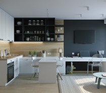 Designed for a young woman, this interior is defined by its smart layout and expertly framed zones. Within 26 square meters, the requirements included a kitchen that feels independent, a spacious wardrobe, and a workable office space. Here you can see the office taking up residence tucked beneath the television, and the transparent Louis Ghost Chair by Phillipe Starck ensures the view goes without obstruction.