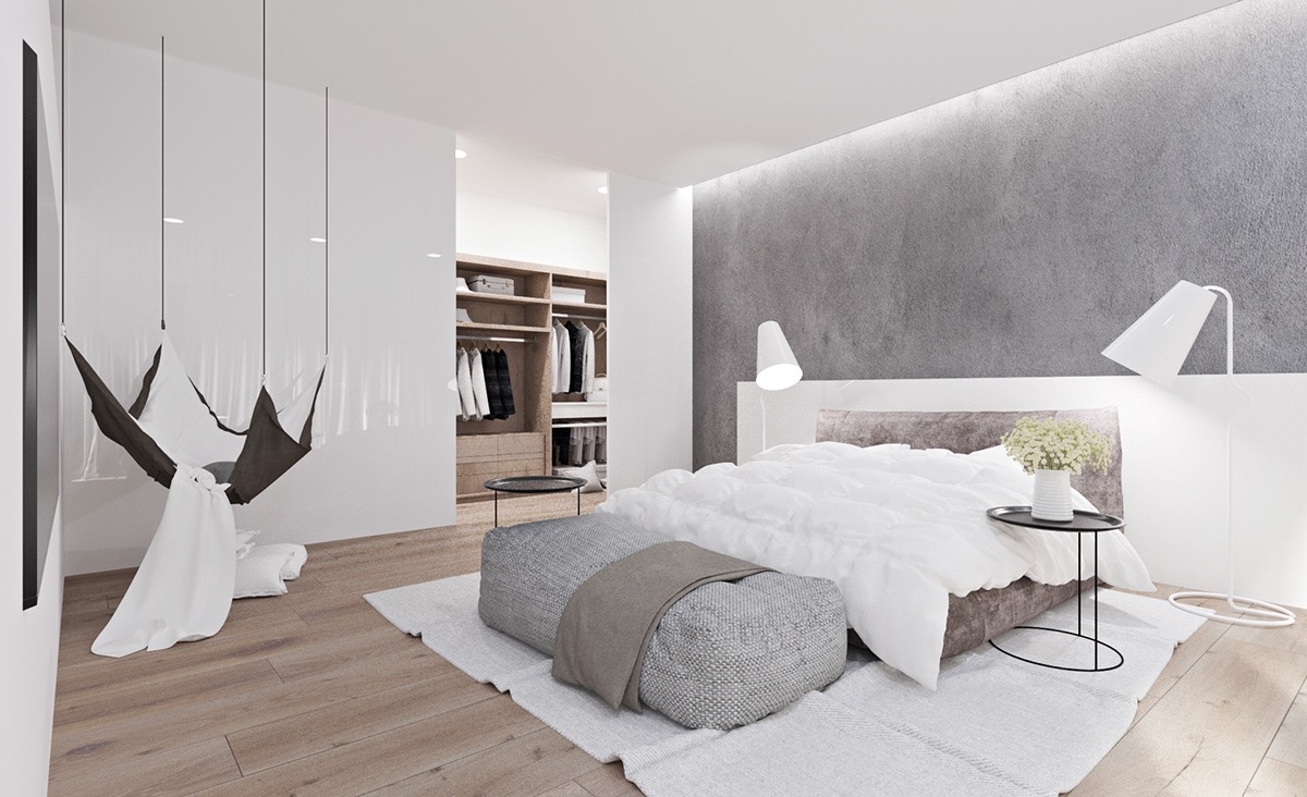 Relaxed upon relaxed is the mantra of this bedroom, grey and white and brown in colour. A hanging hammock and unstructured ottoman invite a simple falling down into plush, dreamy cushions.