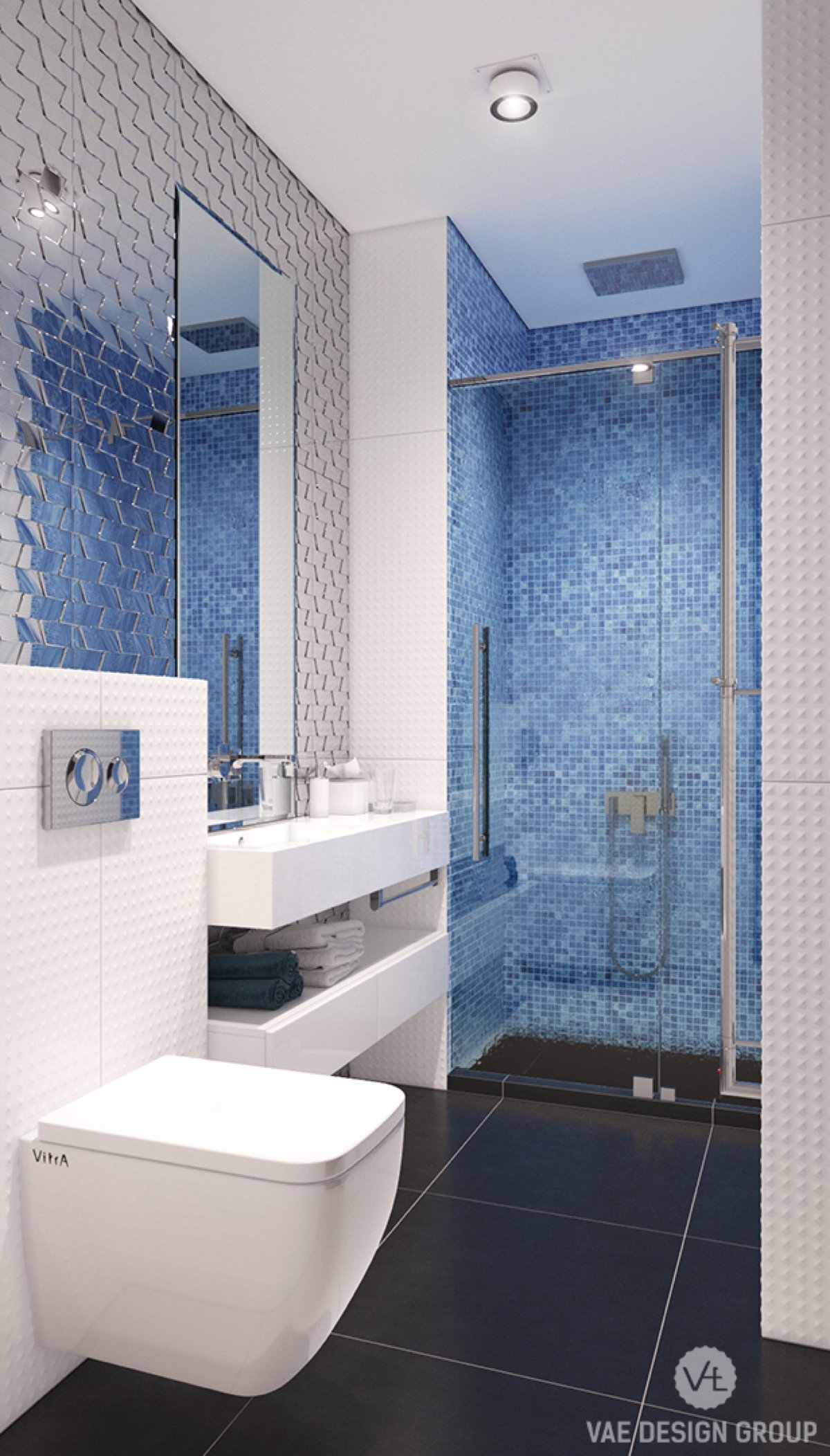 The family bathroom harks to the marine in an understated way. Metallic silver panelling behind the mirror extends it, reminiscent of fish scales. Electric blue tiling says swim, and textured white tiling ties it all together.