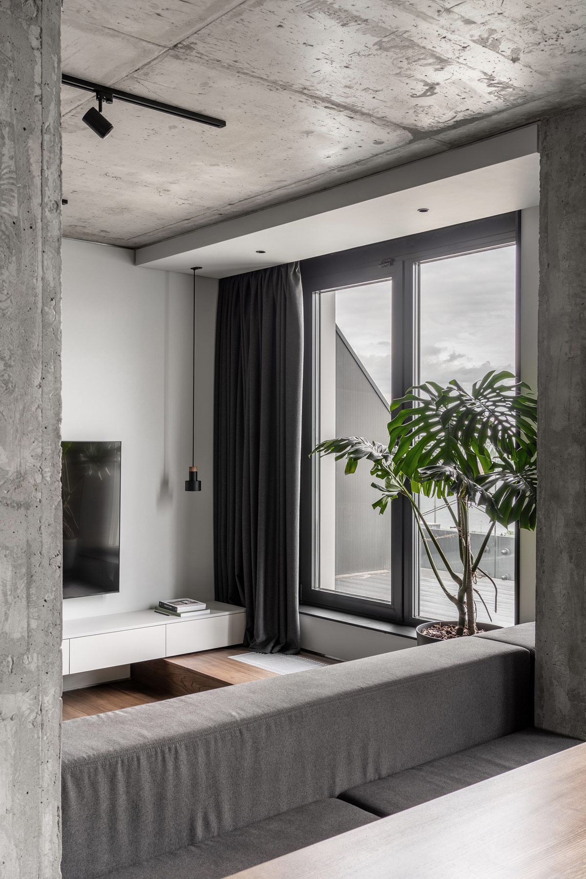 Concrete Monochrome Interiors That Incorporate Glass Wall Rooms