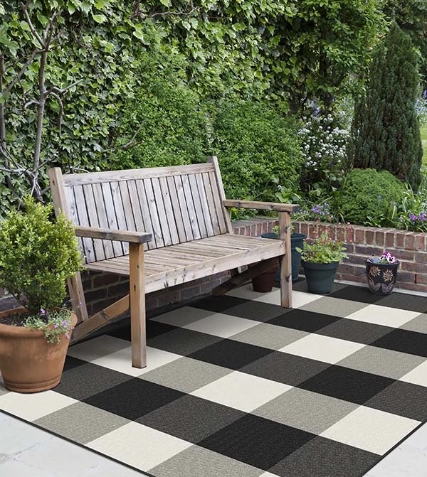 51 Outdoor Rugs To Make Your Patio Feel, Black And Tan Round Outdoor Rugs